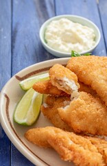 Crispy and Golden: Close-Up of Beer Battered Deep Fried Fish with Lemon in 4K Resolution