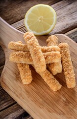 Crispy and Zesty: Panko-Breaded Fish Sticks with Lemon in Exquisite 4K Close-U