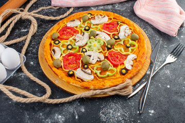 top view mushroom pizza with tomatoes olives mushrooms with eggs and ropes on the grey desk pizza dough italian food