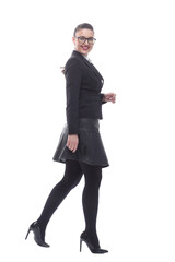 in full growth. smiling businesswoman confidently striding forward