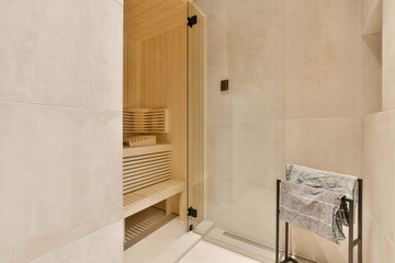 a bathroom with a towel rack on the wall and an open shower stall in the corner next to the bathtub