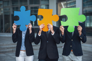 Business people with puzzles