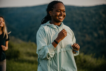 Active Lifestyle in the Wilderness: Embracing an active lifestyle, black and white female joggers...