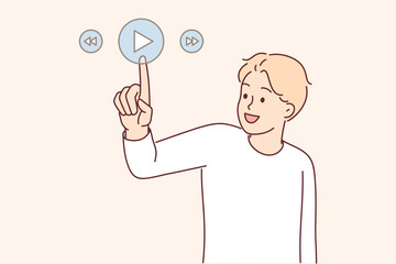 Man presses play button on virtual digital pad to launch music player or online cinema