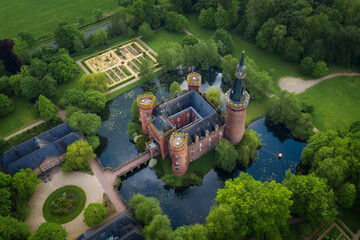 Aerial drone view medieval water castle Moyland fortress North Rhine-Westphalia, Germany.