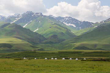 Ala Bel pass, Kyrgyzstan - 15 June 2022: Kyrgyz Yurts and other summer dwellings in the mountains....