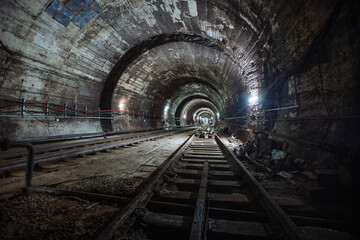 Fototapeta na wymiar Round underground subway tunnel with tubing