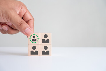 Target customer concept, buyer persona, marketing segmentation, job recruitment, Customer relationship management (CRM). Wooden cube blocks with focused on target customer symbols.