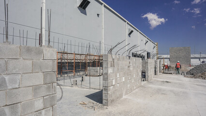 In warehouse building construction site against blue sky, And grey walls.