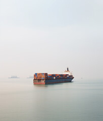 Ship with cargo containers in the sea.