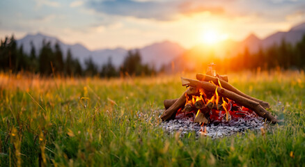 beautiful wood campfire on a beautiful mountain and amazing sunset