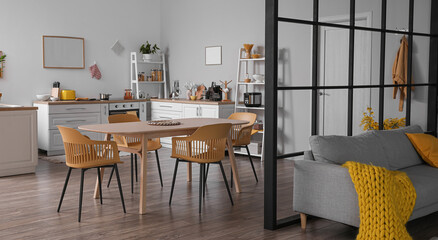 Modern studio apartment interior with kitchen and sofa