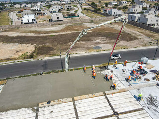 aerial view of construction site. Four construction workers having meeting,stock photo