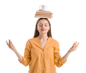 Young woman with cup and books meditating on white background. Balance concept