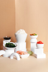 Composition with tasty Chinese food and plaster decor on color background