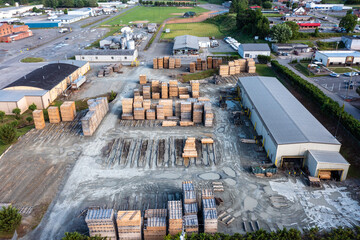 Aerial View of a Large Lumber Yard with Stacked Wood Planks Outside in Galax Virginia