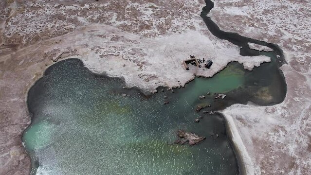 aerial view of people resting in the hot springs of aguas calientes in the altiplano 