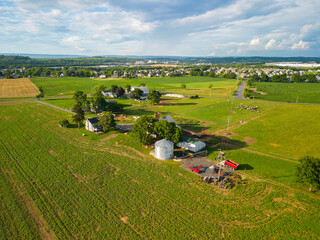 Aerial drone photo of agriculture/farmland during sunset.