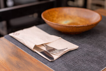 A place setting on a table at a restaurant 