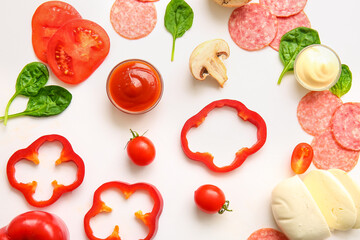 Fresh ingredients for preparing pizza on white background