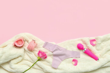 Composition with female panties, sex toys, rose flower and plaid on pink background