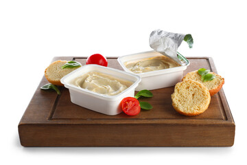 Plastic containers with tasty cream cheese on white background