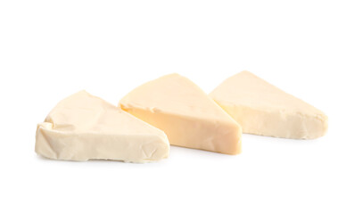 Triangles of tasty processed cheese on white background