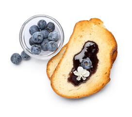Toasts with sweet jam and fresh blueberries in jar isolated on white background