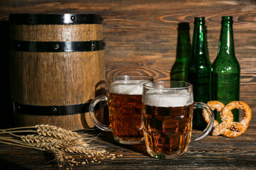 Mugs of cold beer on wooden background. Oktoberfest celebration