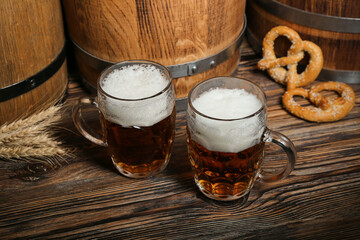 Mugs of cold beer on wooden background. Oktoberfest celebration