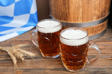 Mugs of cold beer on table. Oktoberfest celebration