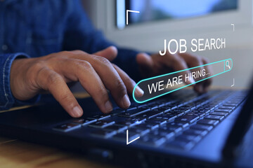 New graduate man use laptop to find a job or job search and job finding work on the internet or job...
