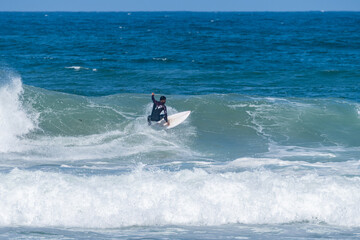 Surfer riding waves in Furadouro Beach