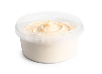 Plastic container with tasty cream cheese on white background