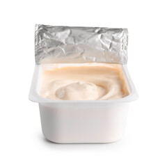 Plastic container with tasty cream cheese on white background
