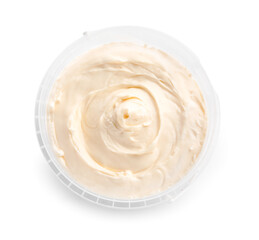 Plastic container with tasty cream cheese on white background