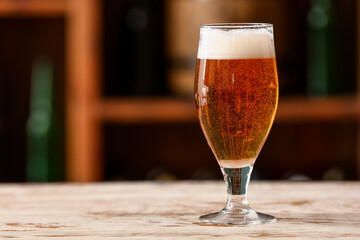 Glass of beer on table in bar. Oktoberfest celebration