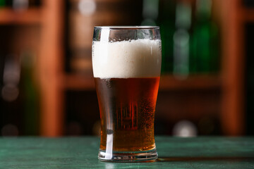 Glass of beer on table in bar. Oktoberfest celebration