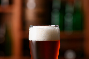Glass of beer in bar, closeup. Oktoberfest celebration