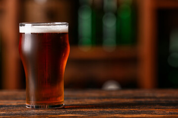 Glass of beer on table in bar. Oktoberfest celebration