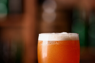 Glass of beer in bar, closeup. Oktoberfest celebration