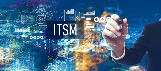 ITSM - Information Technology Service Management theme with businessman in a bokeh neon light trails city night background