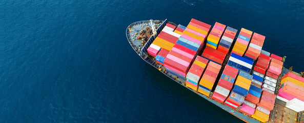 Aerial top view Cargo Ship carrying container and running for export goods from cargo yard port to...