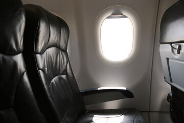 Seat inside of the plane and window space. The air line support traveler for journey to someplace. Low cost airline in domestic.
