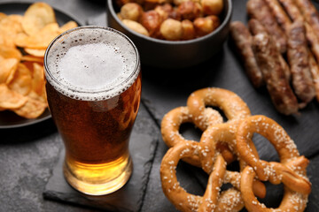 Glass of cold beer on black background. Oktoberfest celebration