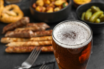 Glass of cold beer on black background. Oktoberfest celebration