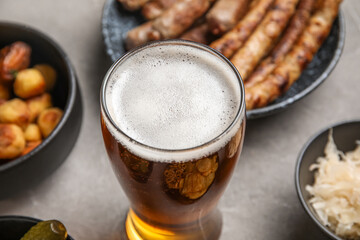 Glass of cold beer on grey background. Oktoberfest celebration