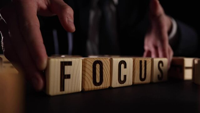 Focus. Cubes form the word Focus. The concept of the word Focus is applicable to both business and life