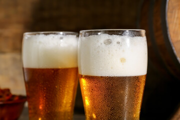 Glasses of cold beer on table, closeup
