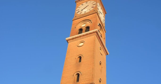 Low angle shot of Torre Civica against blue sky in Forli, Province of Forl&igrave;-Cesena, Italy on a sunny day.